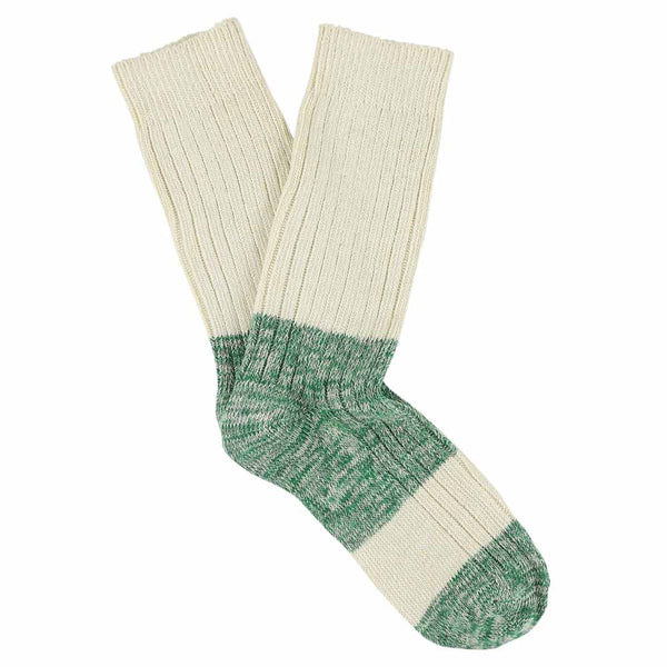 A pair of melange block socks in ecru and green colors, crafted from cotton blend yarns and made in Portugal