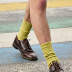 Man wearing cumin ribbed crew socks by Escuyer, made in Portugal
