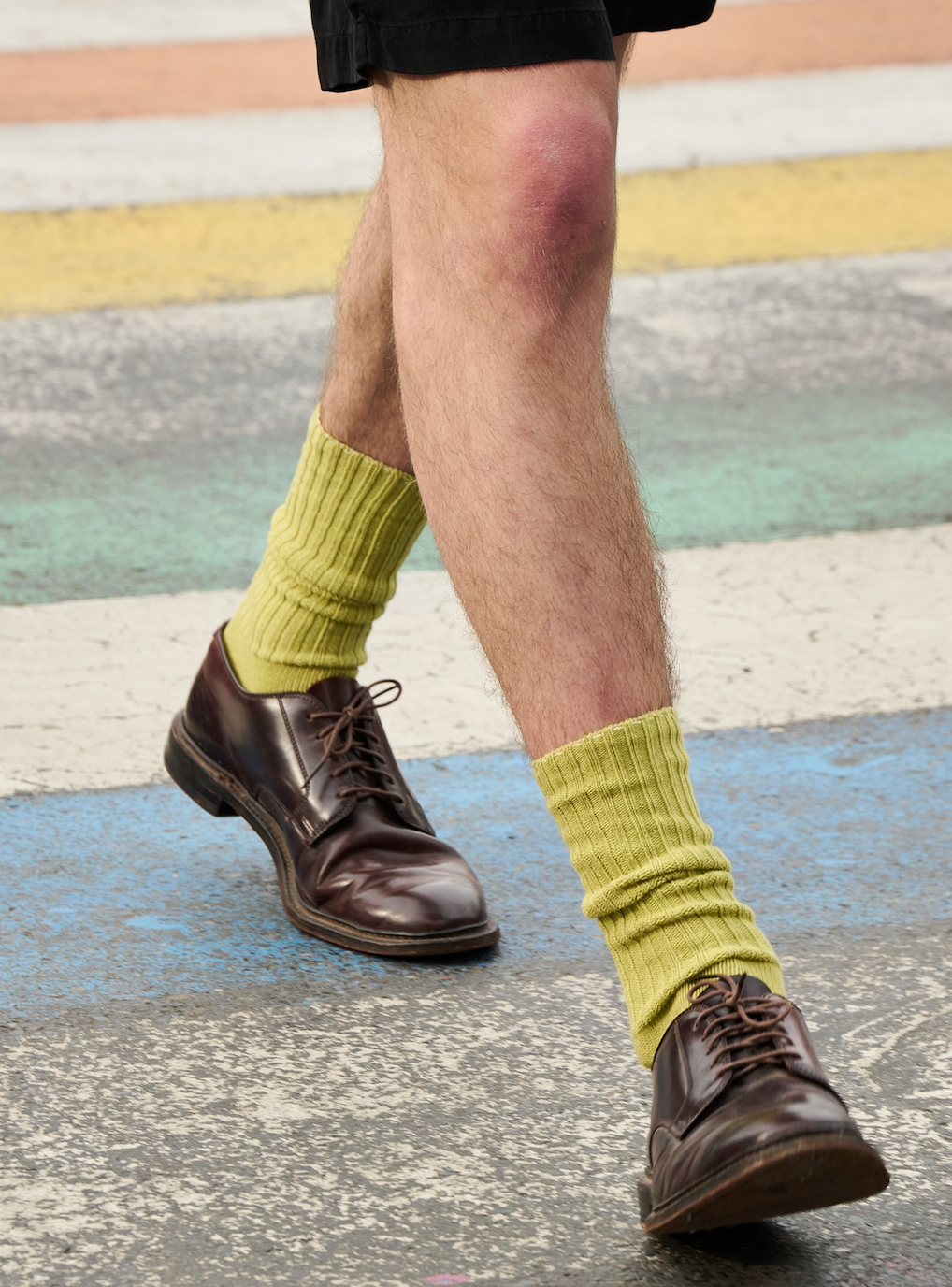 Man wearing khaki ribbed crew socks by Escuyer, made in Portugal