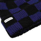 Side view of black and blue checkered knit merino beanie