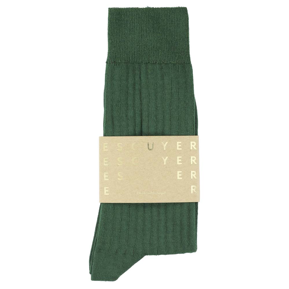 Green sock with a beige label on a white background