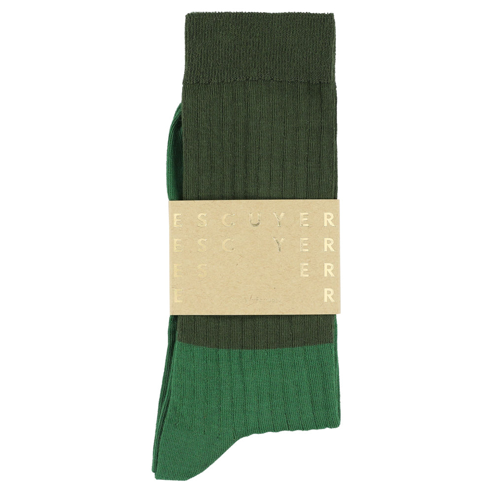 Green sock with a beige band on a white background