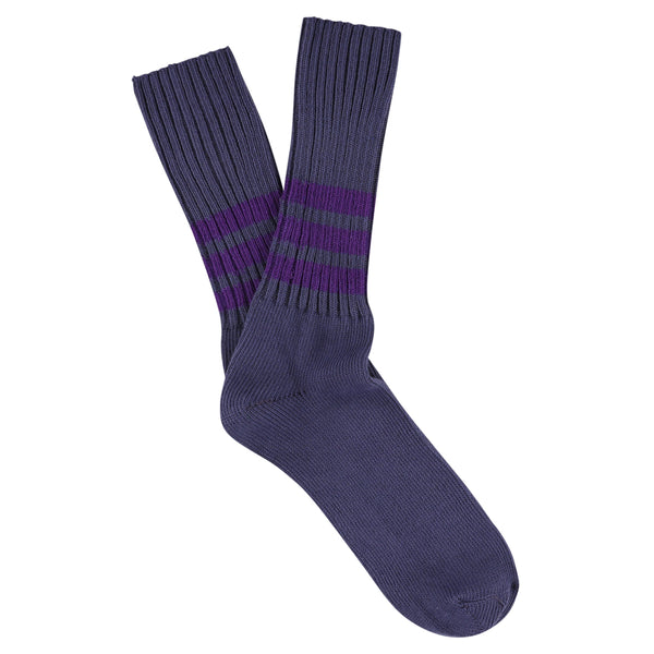 Pair of dark gray socks with purple stripes on a white background