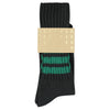 Black and green striped socks with a label on a white background