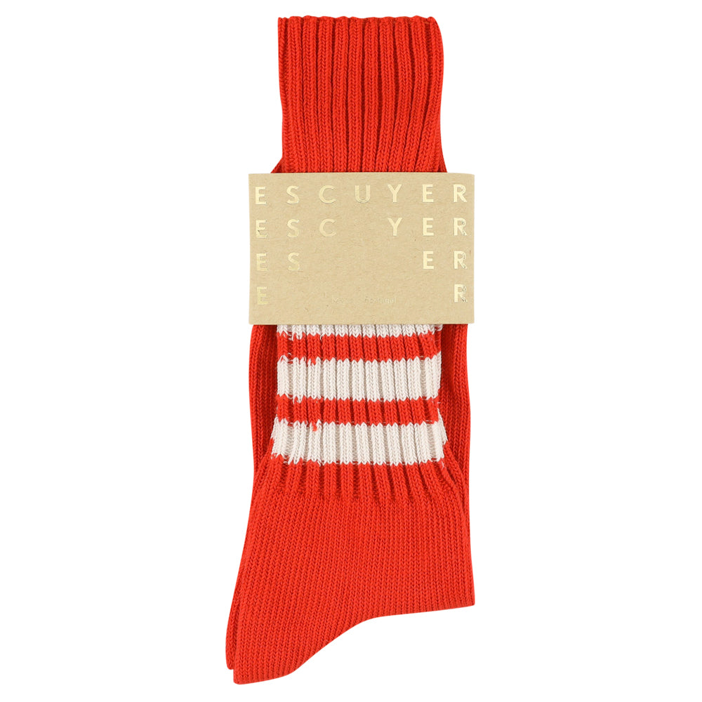 Orange sock with white stripes and 'ESCUYER' label on a white background