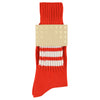 Orange sock with white stripes and 'ESCUYER' label on a white background