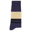 Navy sock with a beige label on a white background