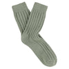 Pair of green wool and cashmere socks on a white background