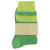 Green sock with a striped pattern on a white background