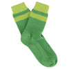 Green sock with a striped pattern on a white background