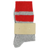 Gray and red striped socks made in Europe with a beige label written "ESCUYER" 
