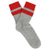 Grey sock with red stripes on a white background