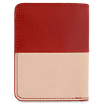Escuyer red and pink slim wallet showing horizontal colour-block split and slim profile
