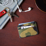 Escuyer camouflage leather cardholder with keys and accessories on wooden surface — lifestyle shot