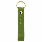Escuyer jungle green leather keychain — Italian vegetable tanned leather tab with gold metal ring and gold Escuyer logo