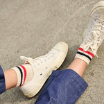 Close-up of Escuyer Women Striped Ankle Socks Ecru / Blue / Orange — retro stripe detail at the cuff