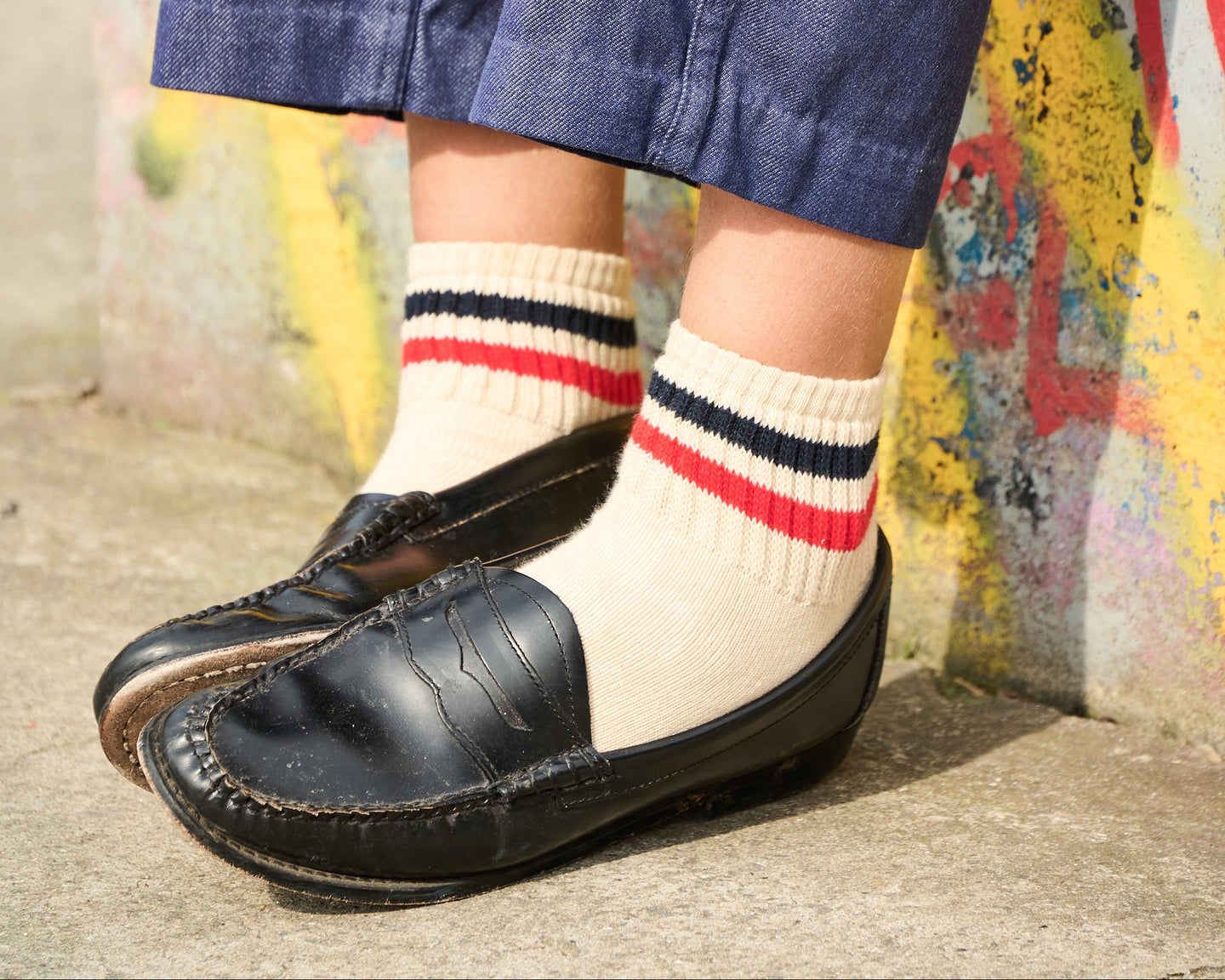 Women wearing ankle socks with black loafers