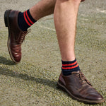 Man wearing Escuyer Men Striped Ankle Socks Bright Blue / Ecru with brown loafers — bold summer style