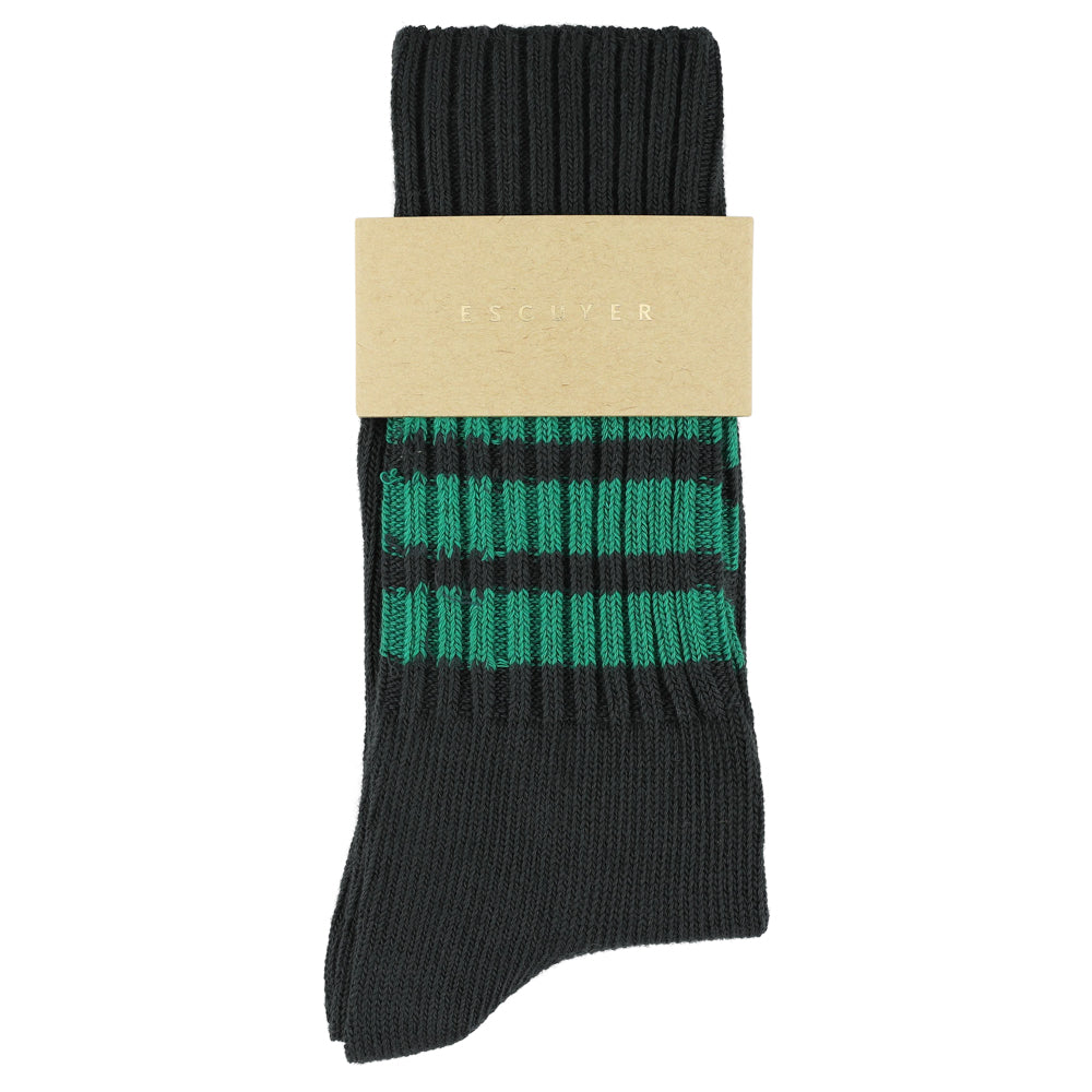 Black sock with green stripes on a beige card, brand 'ESCUYER' visible