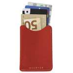 Escuyer red leather card sleeve holding cards and a folded banknote — holds up to 8 cards