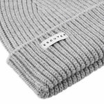 Side view of light grey ribbed merino wool beanie with folded cuff