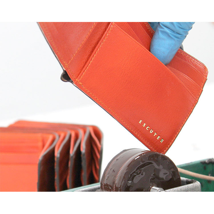Escuyer light brown and orange billfold wallet — atelier production detail, handmade in Portugal